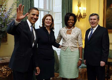 U.S. President Barack Obama (L) and first lady Michelle Obama (2nd R) meet with British Prime Minister Gordon Brown (R) and his wife Sarah at 10 Downing Street in London April 1, 2009. World leaders will have their work cut out at a G20 summit where Obama makes his first major international sortie, under perhaps more pressure than anyone to show that the country where the crisis began can lead the way out.