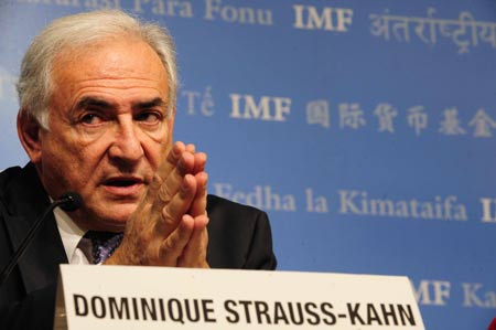 Dominique Strauss-Kahn, managing director of the International Monetary Fund (IMF), speaks druing a news conferece at IMF headquarters in Washington, on April 23, 2009. Strauss-Kahn said on Thursday that the global economic crisis still had "long months" to go before it finished. (Xinhua/Zhang Yan)