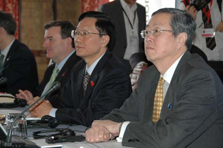 Chinese Finance Minister Xie Xuren (2nd R) and Zhou Xiaochuan (R), governor of the People's Bank of China, China's central bank, attend the opening ceremony of the G20 Finance Ministers' meeting at a hotel near Horsham in southern England March 14, 2009. (Xinhua/He Dalong)